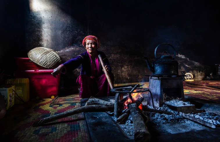 woman cooking in house of palaung tribal village myanmar