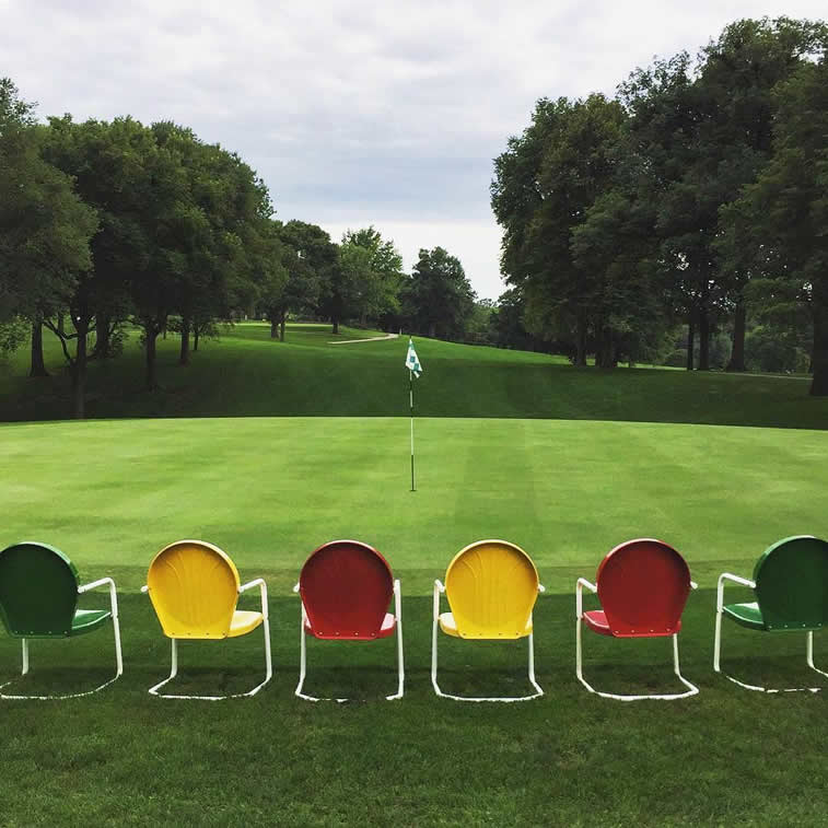 grass filed empty chairs