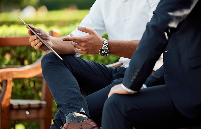 business meeting people on a bench