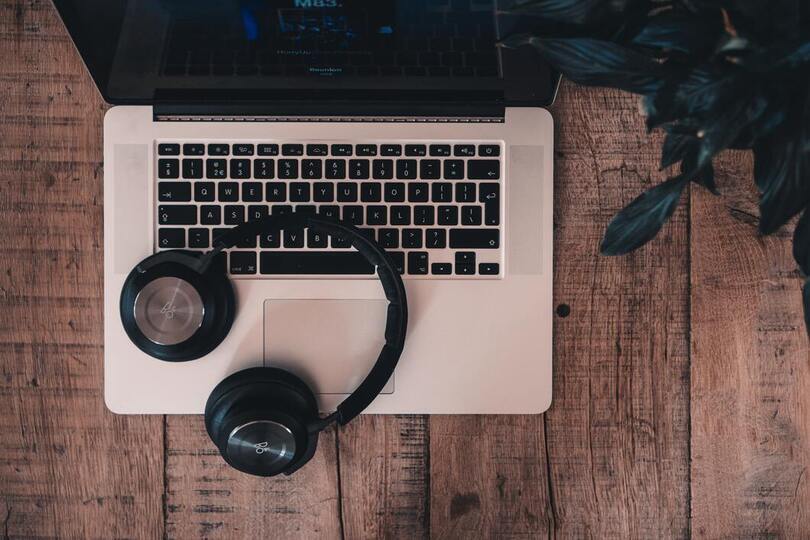 laptop and headphones on a table